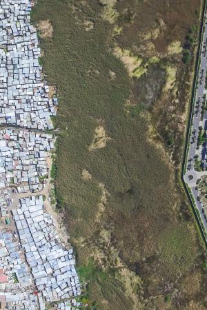 Photo of Masiphumele and Lake Michelle, Cape Peninsula, South Africa. Photo by Johnny Miller, Unequal Scenes. Used with permission.